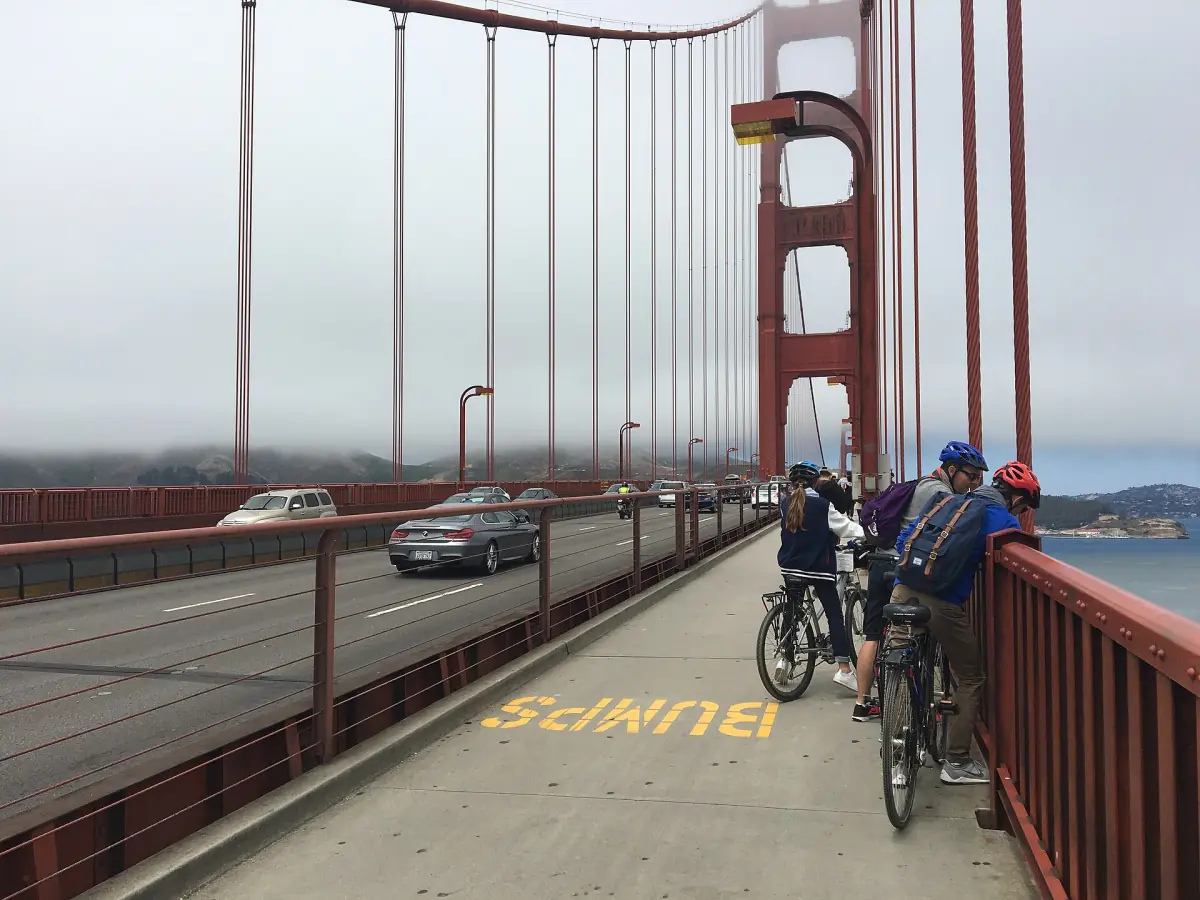 Cyclists on the bridge sidewalk